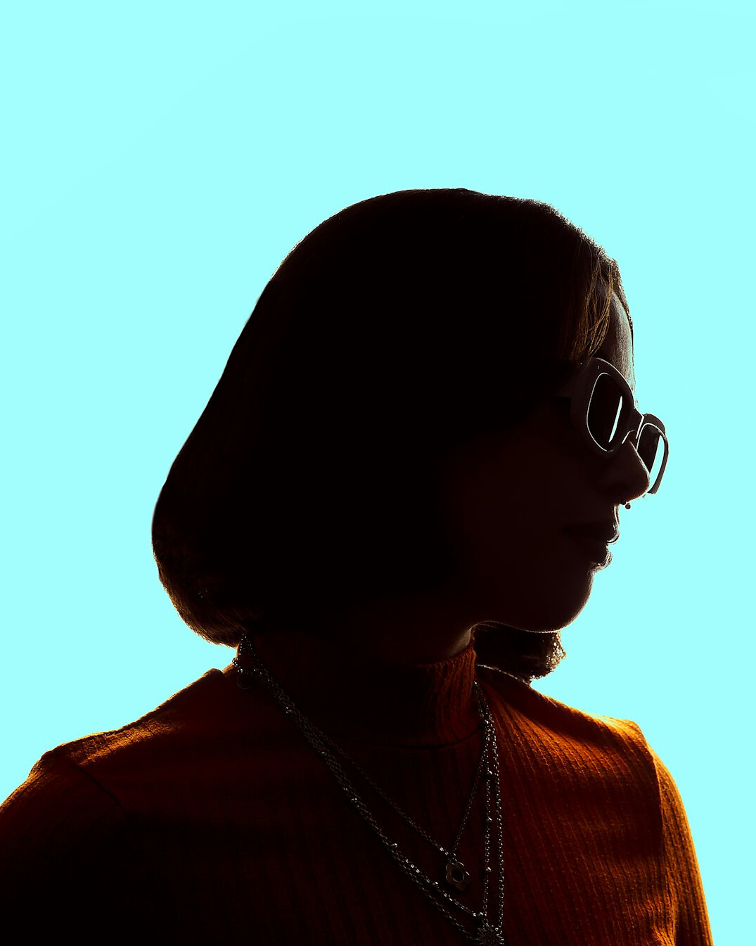 Studio portrait of a woman with glasses